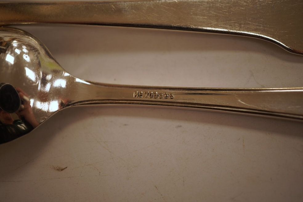 A 19th century matched part canteen of 19th century silver fiddle pattern flatware including a soup ladle and a sauce ladle, twelve table spoons, eight table forks, eight dessert forks, eight dessert spoons and six teasp